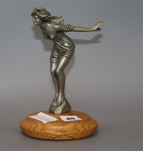 A plated nickel Spirit of Triumph car mascot, on wooden stand height 21cm